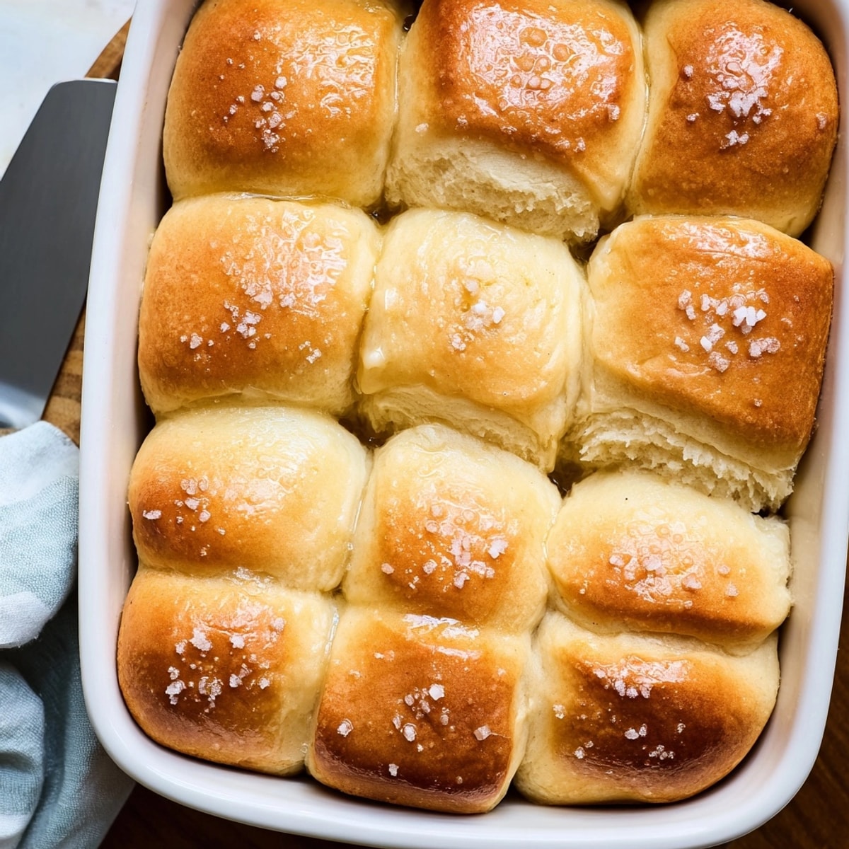 Golden Salted Honey Butter Parker House Rolls, warm from the oven and ready to serve.