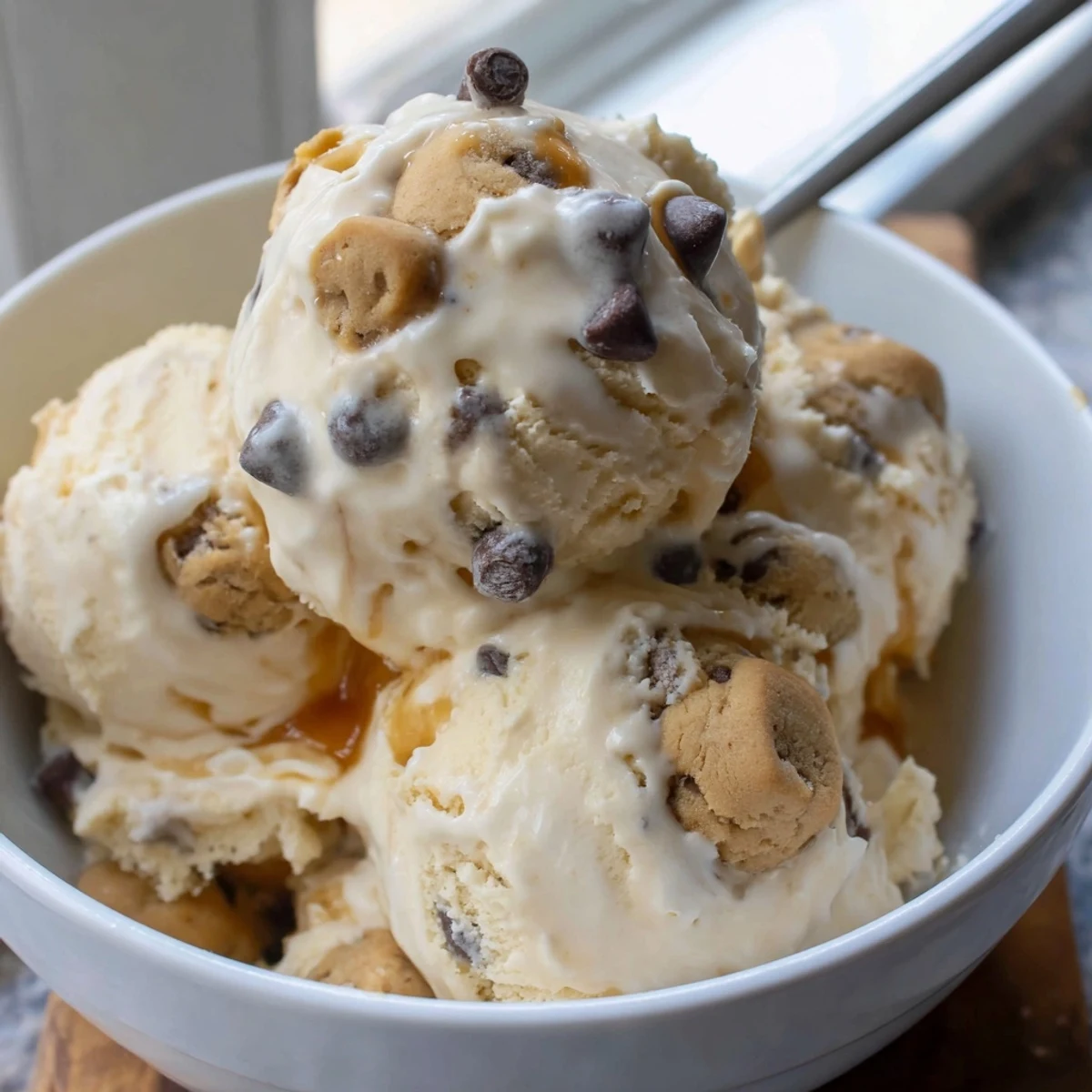 Creamy cottage cheese ice cream swirled with mini chocolate chip cookie dough bites.  