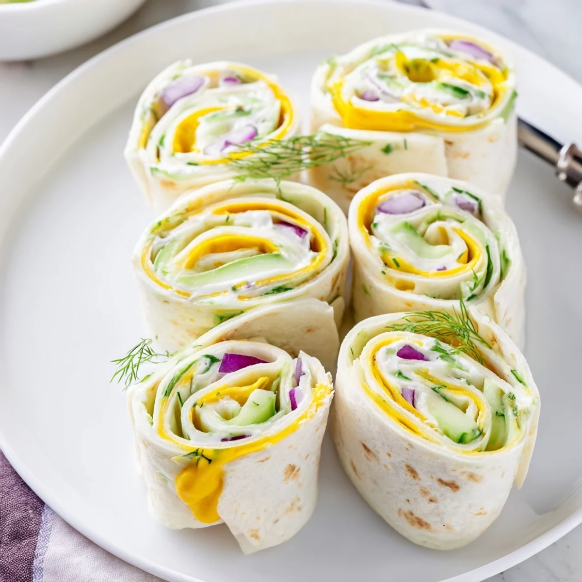 Delicious Pickle-in-a-Blanket appetizers, blending crunch and creaminess for a tasty snack.