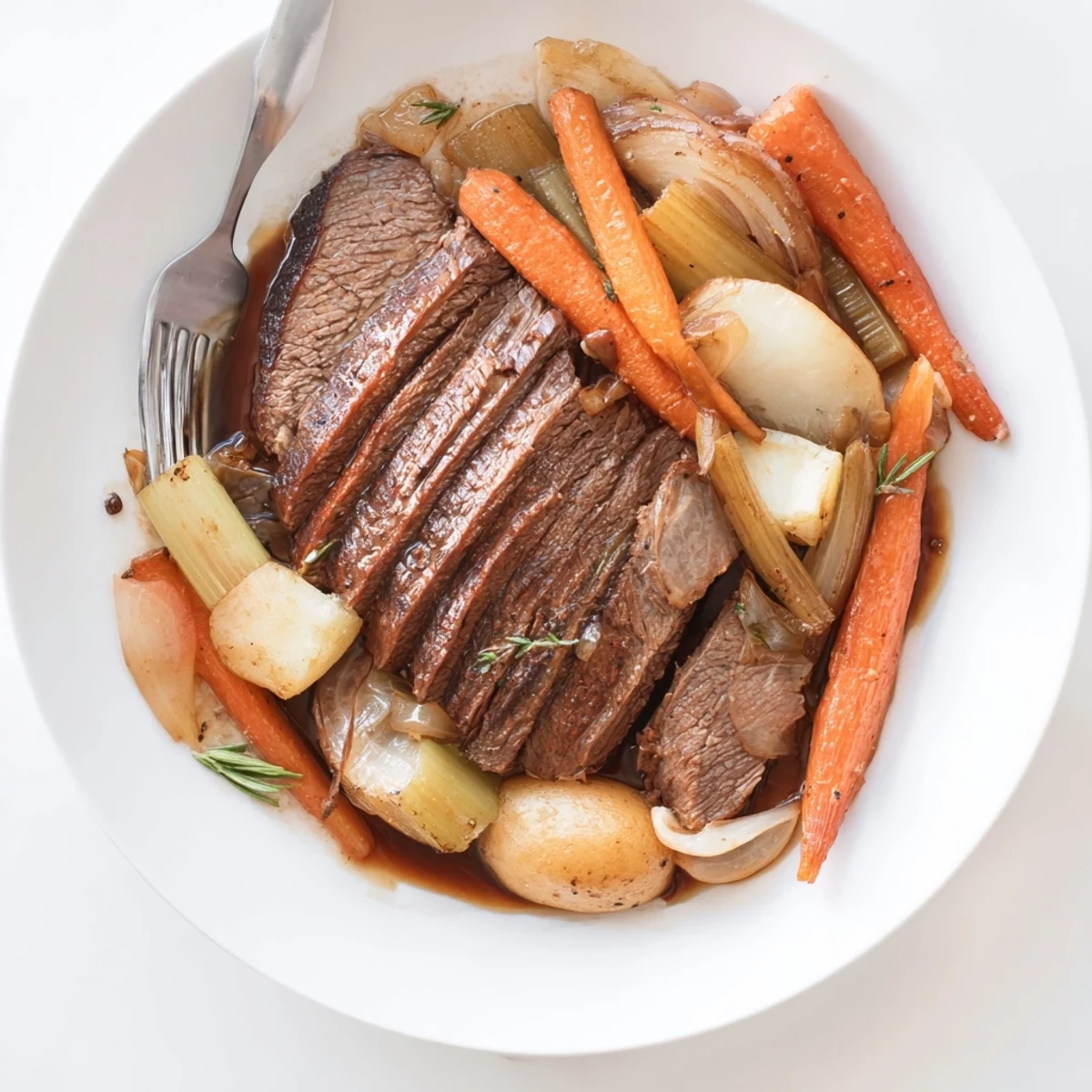 A mouthwatering Sunday Pot Roast garnished with vibrant, caramelized vegetables for comfort.