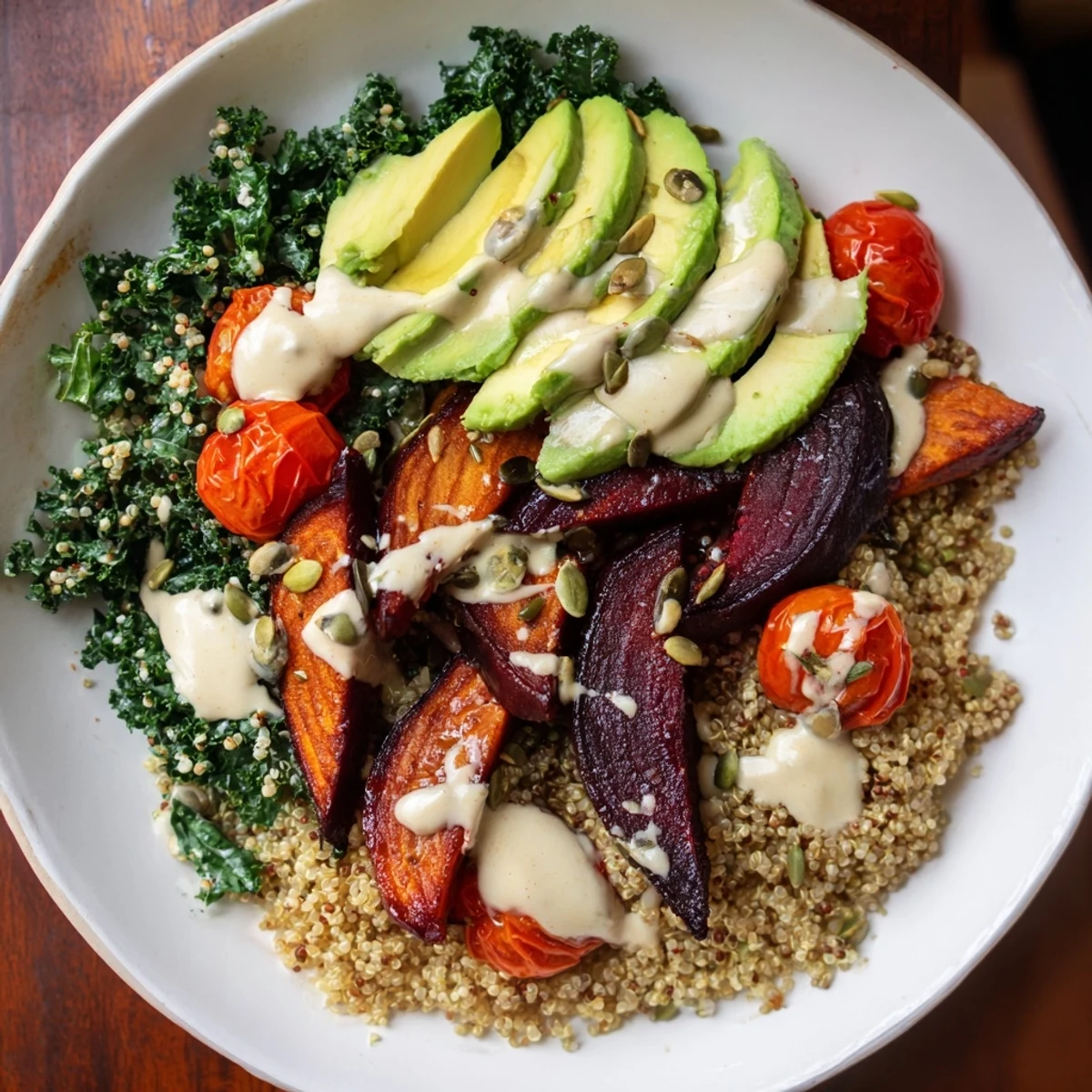 Golden roasted beets, fresh kale, and quinoa creating a colorful Quinoa, Kale & Roasted Beet Bowl.