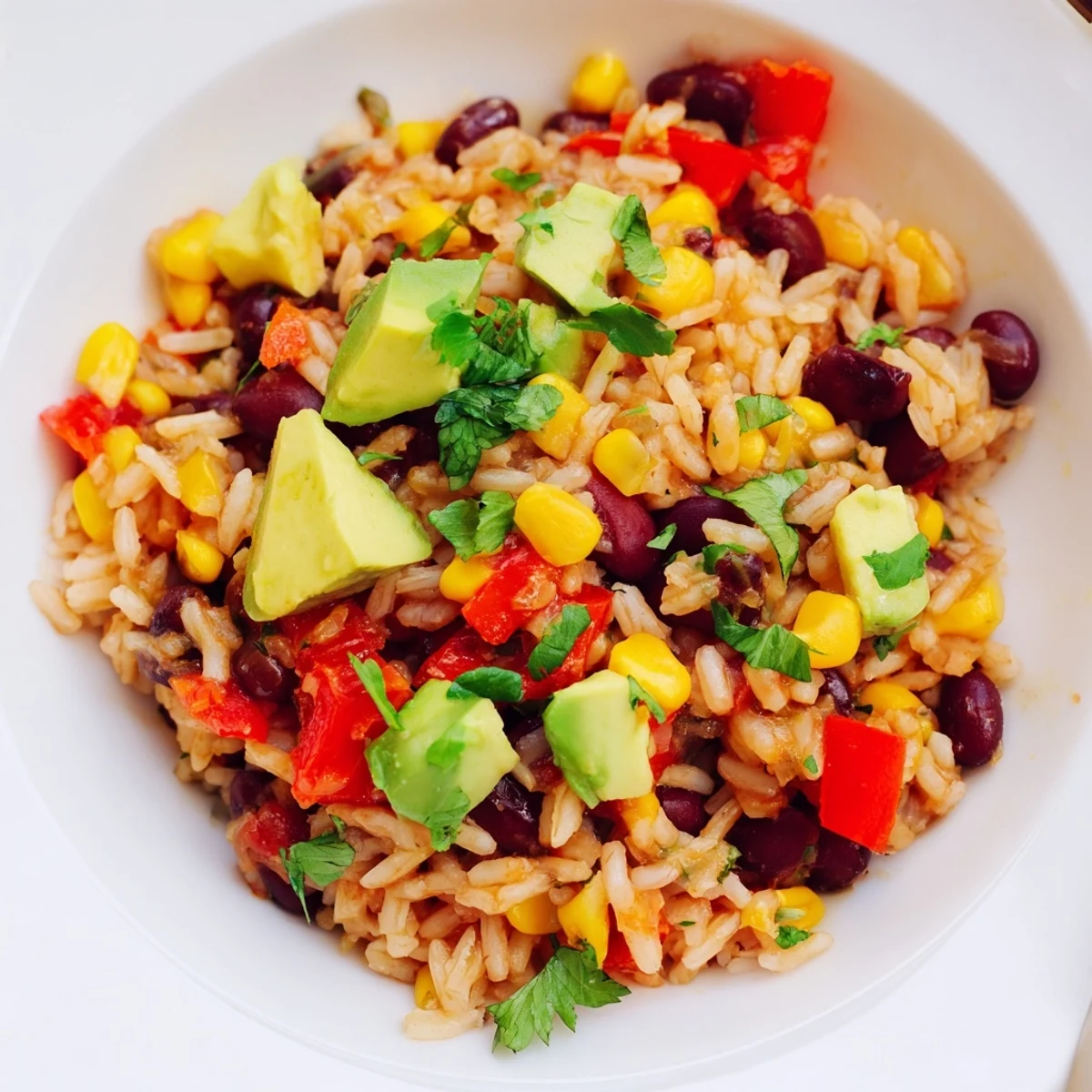 Steaming, flavorful One-Pot Mexican Rice & Beans, garnished with cilantro and lime, ready to serve.