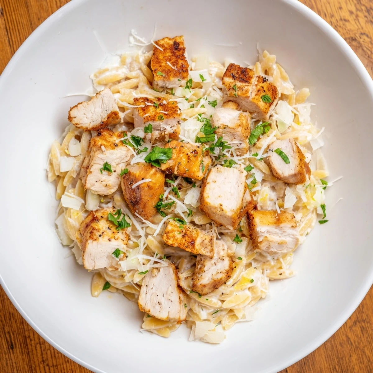 Golden chicken and orzo pasta in this flavorful Cajun Chicken Alfredo, ready in a single pot.