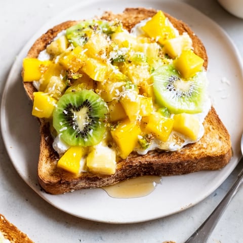 Delicious Yogurt-Custard Toast topped with fresh mango and kiwi for brunch.  