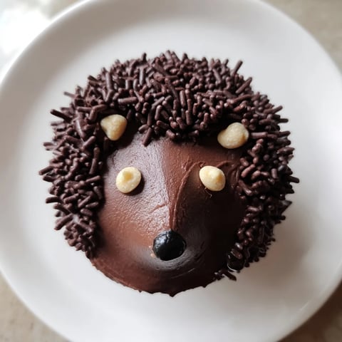 Close-up of a whimsical Hedgehog Cupcake Tower, chocolatey and delicious, ready for a kids' party treat.