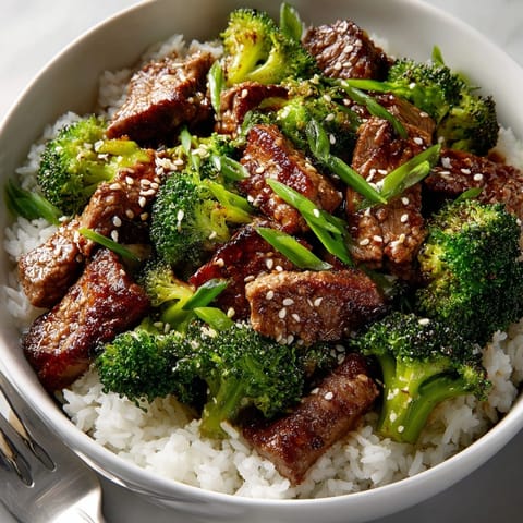Close-up of Beef and Broccoli Rice Bowl, showcasing tender beef and vibrant broccoli florets.