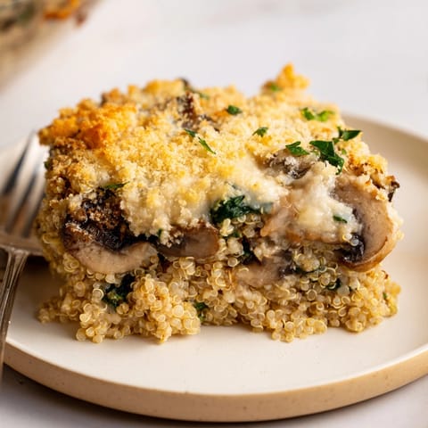 Creamy Alfredo Quinoa Mushroom Bake: Cheesy, savory, and bubbly, a comforting vegetarian casserole.