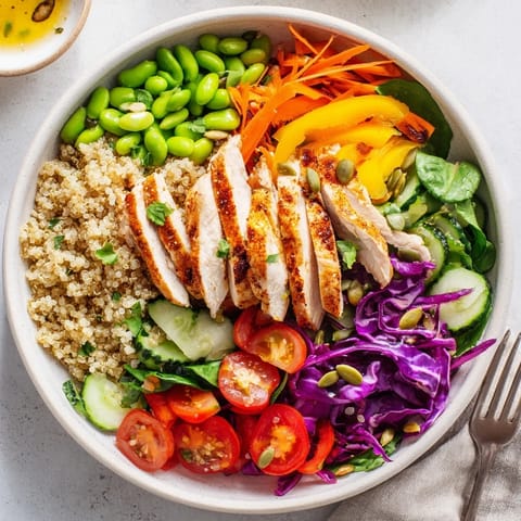 Savory healthy meal-prep bowls featuring quinoa, grilled chicken, and fresh veggies.  