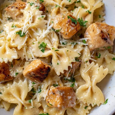 Creamy garlic sauce envelops tender chicken and bowtie pasta in this delicious recipe.  
