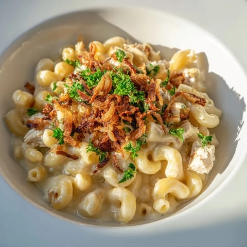 A close-up shot of rich and creamy One-Pot Honey BBQ Chicken Mac and Cheese, ready to be enjoyed.