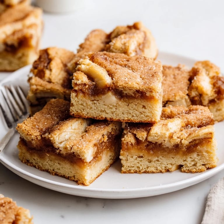 Enjoy these cozy cinnamon sugar apple butter blondies, perfect for autumn gatherings.  