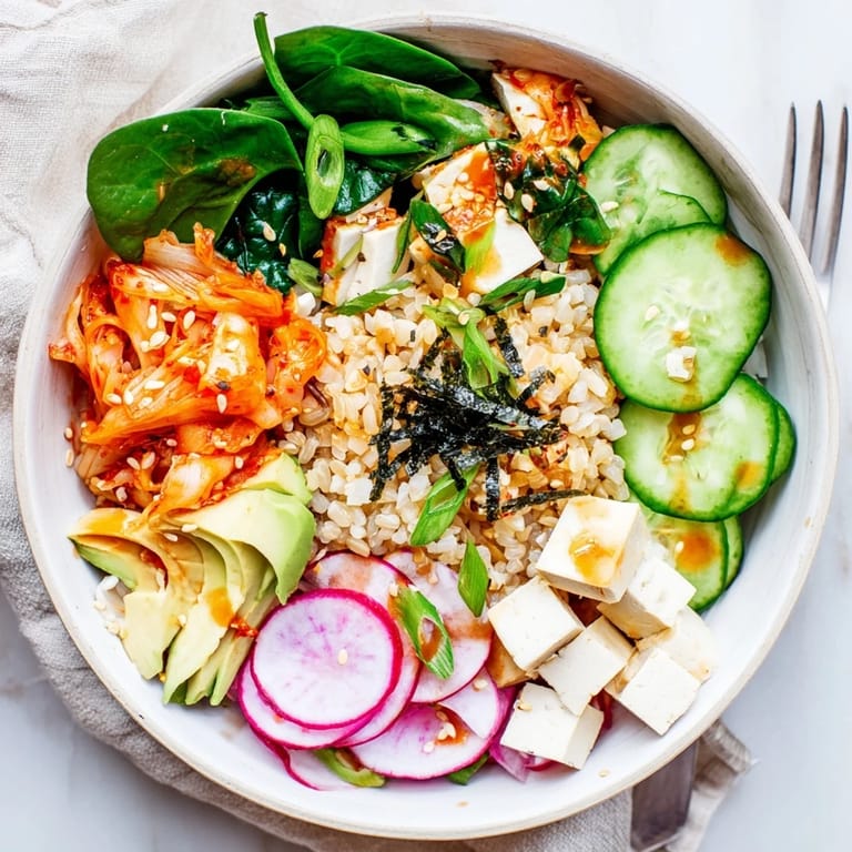 Colorful Fermented Vegetable Bowl with quinoa, fresh radishes, and a savory dressing.  