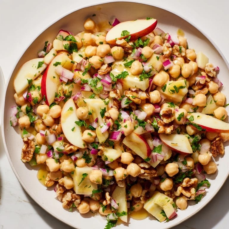 Delicious Fall Harvest Apple and Chickpea Salad: A vibrant vegetarian dish perfect for autumn gatherings.