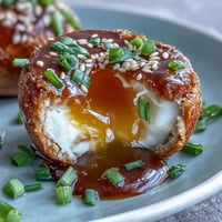 Spicy Miso Marinated Eggs with soft-boiled centers, glistening in savory miso-soy marinade, perfect for ramen bowls.
